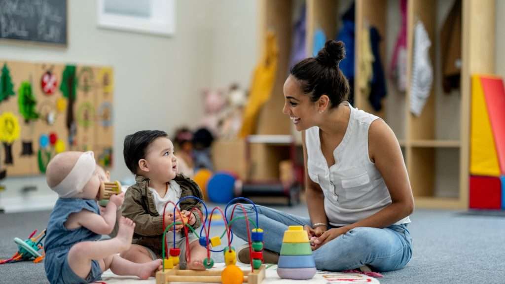 Toddlers interacting with a teacher at a Day Care Center in Palm Bay FL