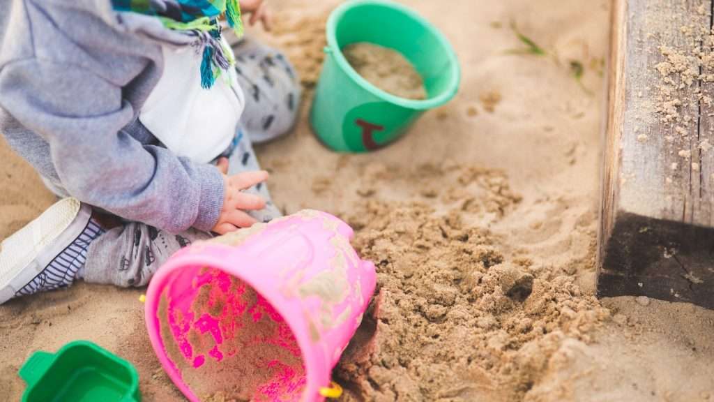 Preschoolers playing at the beach on the Space Coast